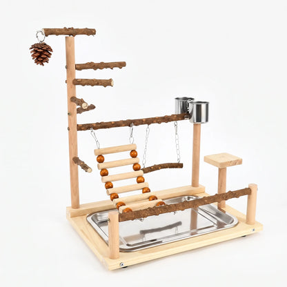 Wooden bird playground on a plain white background, with natural branch perches, a bead ladder, swing, pine cone, steel cups and a tray. 1