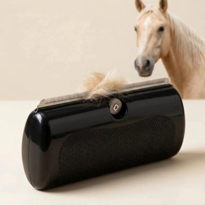 Black handheld grooming tool with a steel-toothed edge holding a tuft of pale hair, a cream palomino horse standing behind it. 1