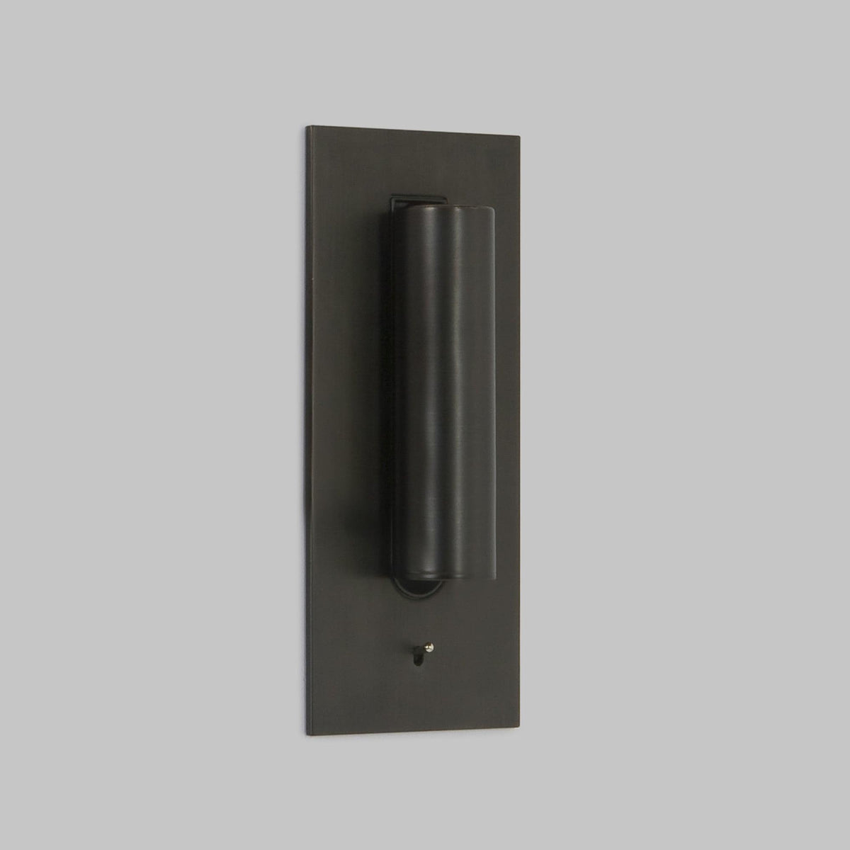 Dark bronze wall light with the tube folded flat against the plate, toggle switch below 2