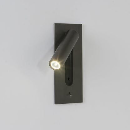 Dark wall light on a pale wall, lit tube angled left, with a close view of the LED lens 5