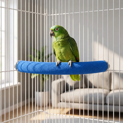 Green parrot perched on the blue sand-textured curved perch, fixed between the white bars of a cage in a living room. 2