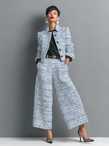 Model wearing the cropped jacket and wide-leg trousers in a light blue and white textured weave over a black top. 3
