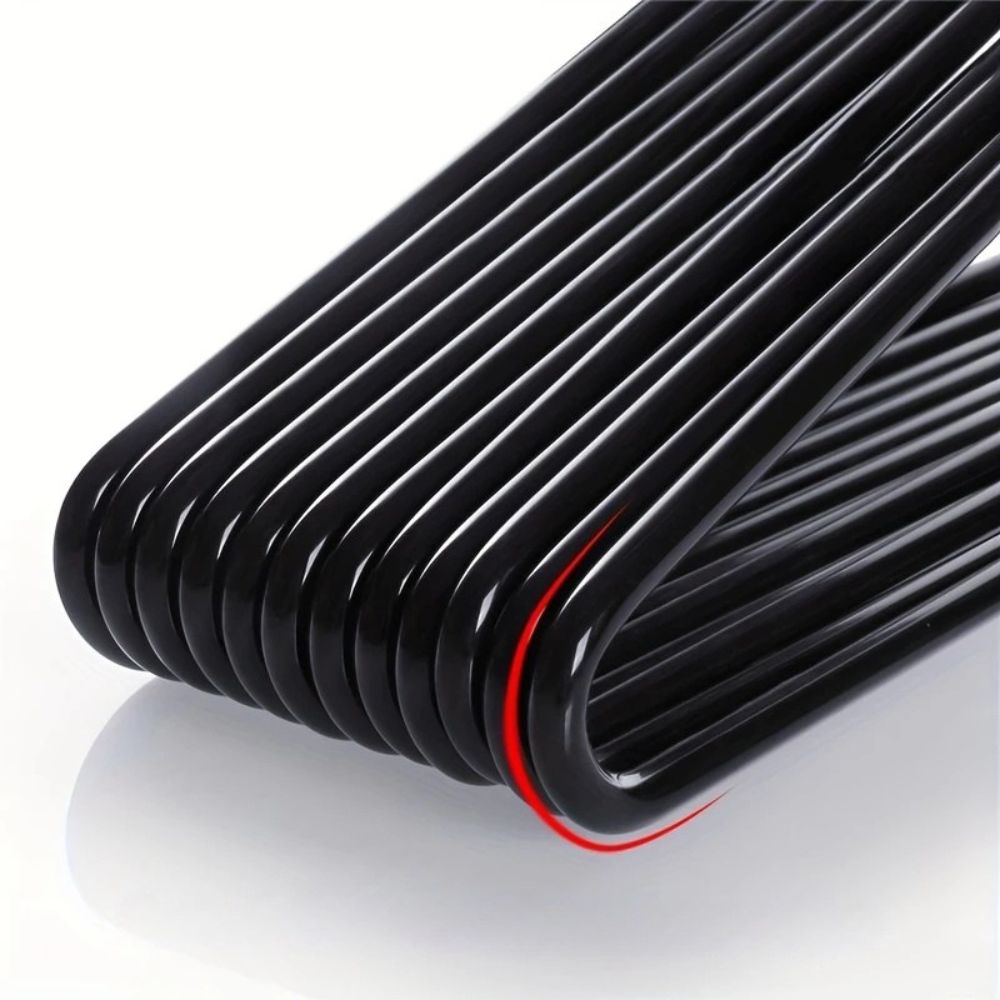 Close-up of the glossy black bent hanger bars stacked together, showing the smooth rounded corners 2