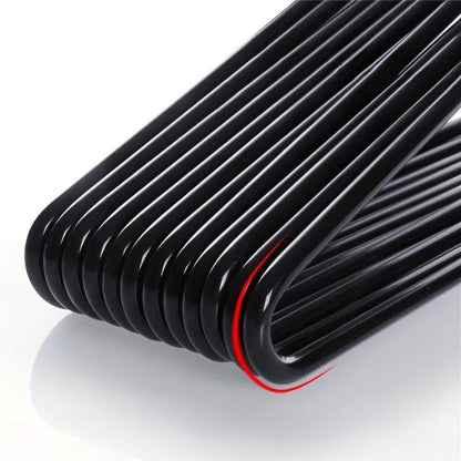Close-up of the glossy black bent hanger bars stacked together, showing the smooth rounded corners 2