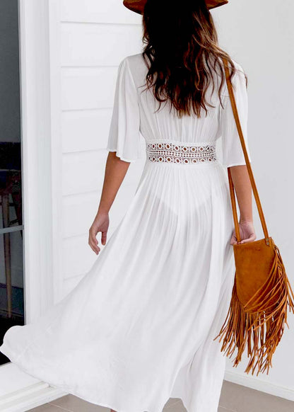 Long beach dress with lace accents and bow fastening – Elara