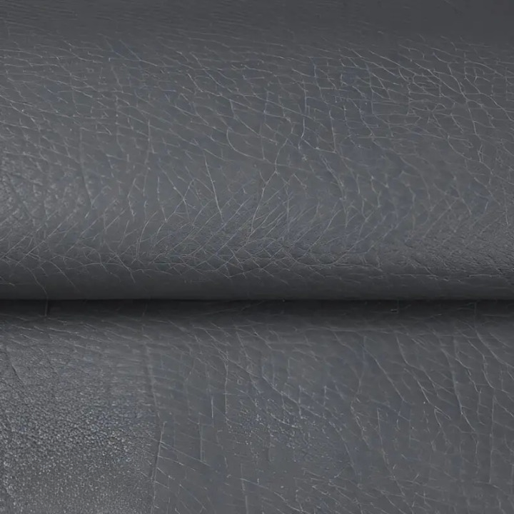 Close-up of the textured grey patch material, folded across the middle 8