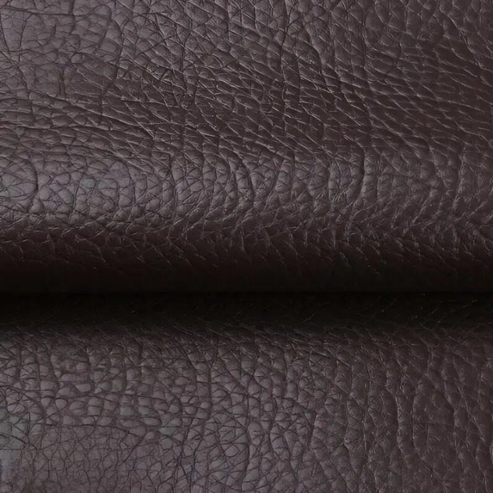 Close-up of the textured dark brown patch material, folded across the middle 9