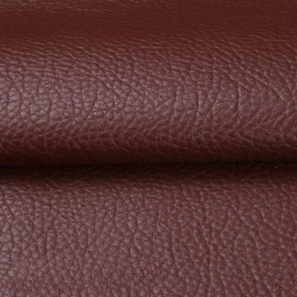 Close-up of the textured reddish-brown patch material, folded across the middle 13
