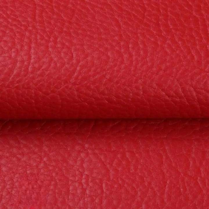 Close-up of the textured red patch material, folded across the middle 14