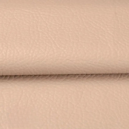 Close-up of the textured pale beige patch material, folded across the middle 15