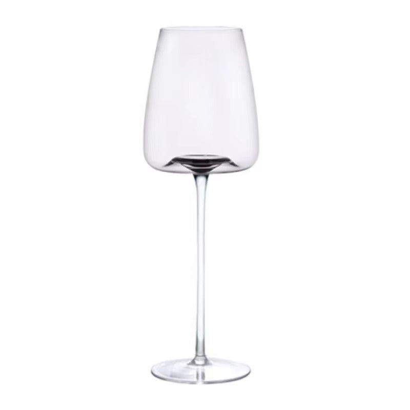 Single empty tulip-shaped wine glass with a slim stem and a faint grey tint on white 11