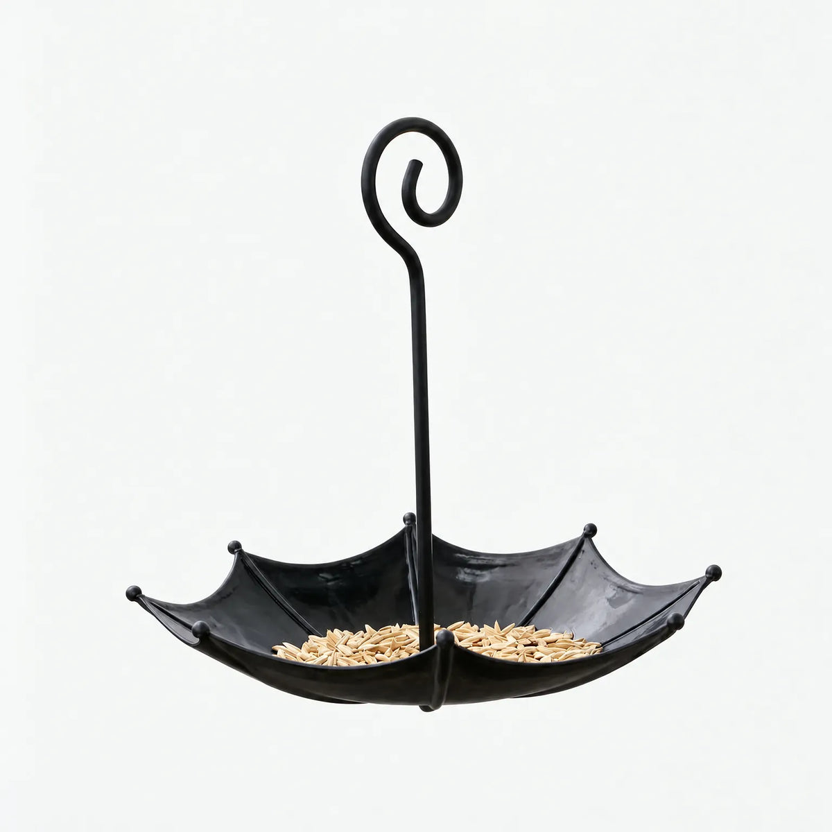 Black version of the umbrella-shaped feeder with a curled handle and seed in the bowl, shown against a white background. 4