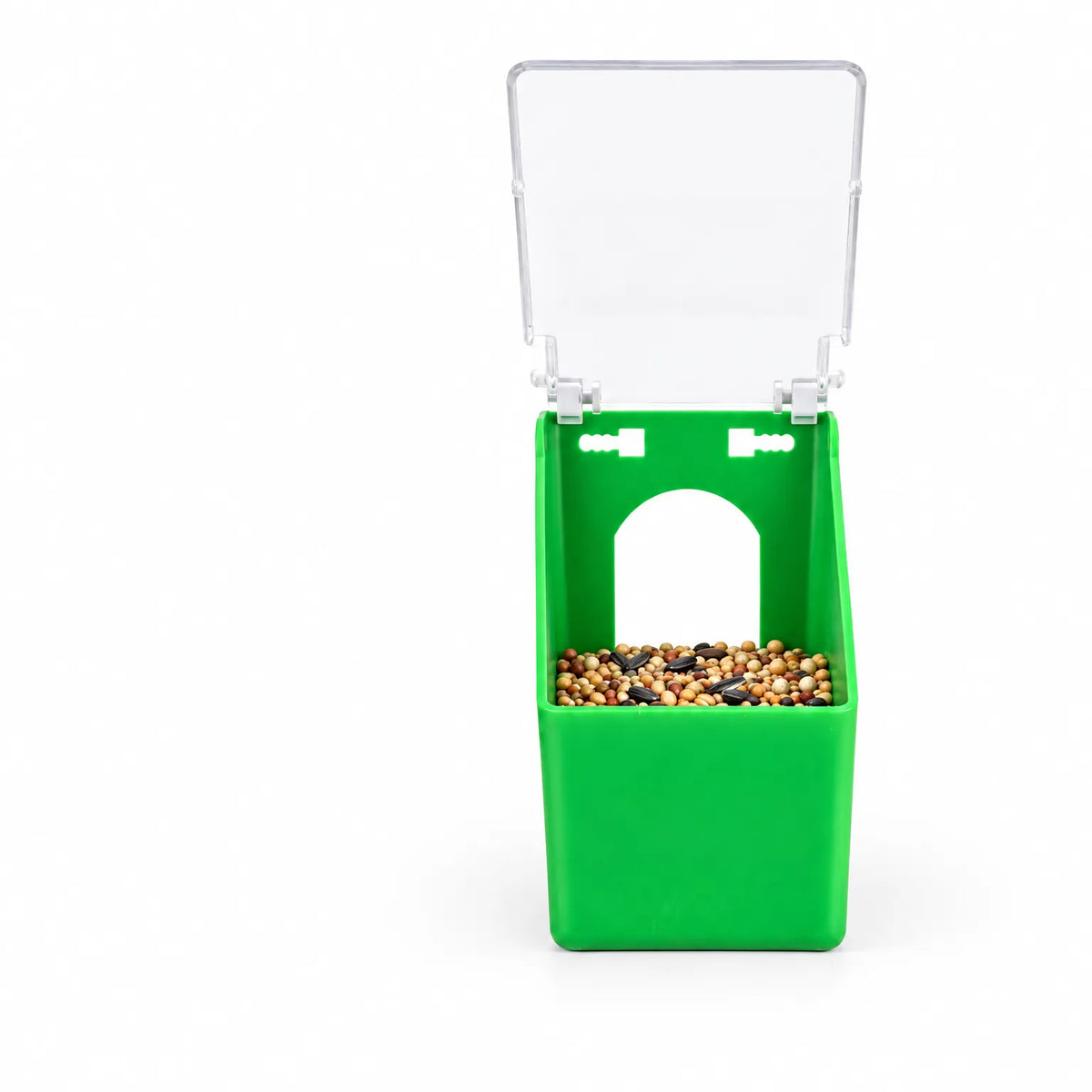 Green plastic feeder seen from the front with its clear lid open, showing a mixed seed blend inside and the arched opening. 1