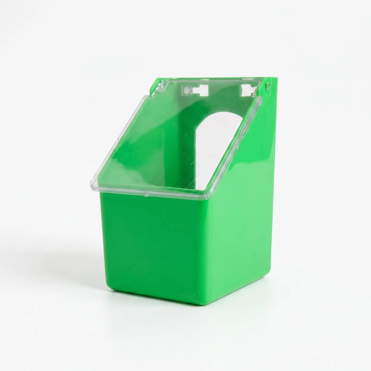 Single-compartment green feeder from a three-quarter angle with the clear lid closed, showing the arched bird opening behind it. 4