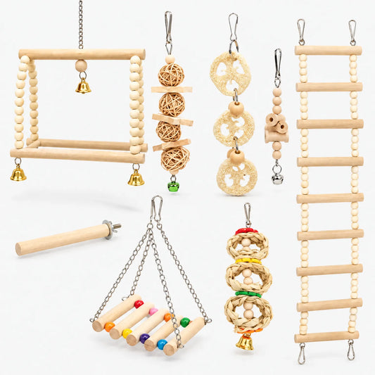Full set of wooden bird toys on white: bead swings, ladder, loofah and rattan chews, a perch and small bells. 1