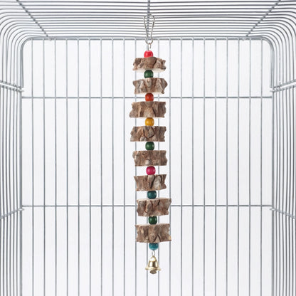 Toy hanging from a metal hook inside an empty wire cage, with bark-edged wooden slices, coloured beads and a small gold bell. 1