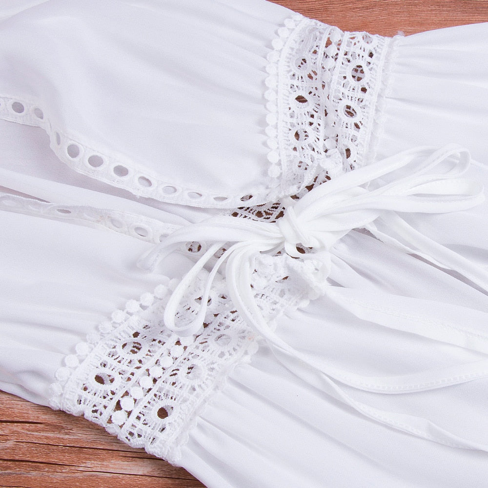 Long beach dress with lace accents and bow fastening – Elara