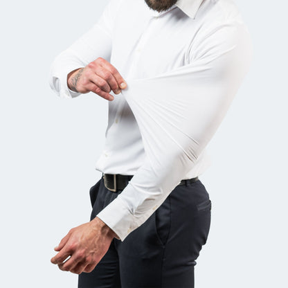 White shirt on a model, one hand stretching the sleeve fabric out from the arm 2