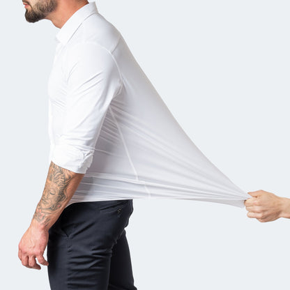 White shirt with sleeves rolled up, a hand pulling the back fabric far out to show stretch 3