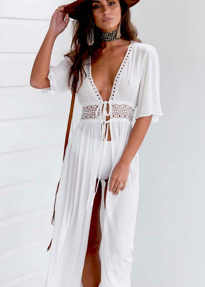 Long beach dress with lace accents and bow fastening – Elara