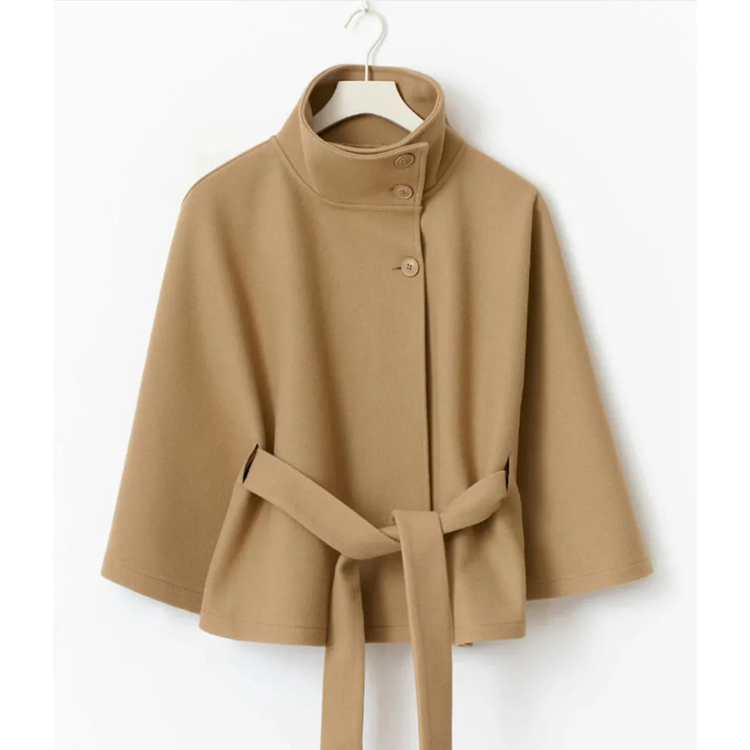 Camel cape jacket on a hanger, showing the high collar, three buttons and tied belt 7