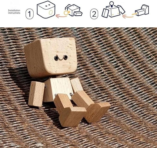 Smiling wooden figure seated on woven fabric, with a small assembly diagram above showing how the parts fit together. 7