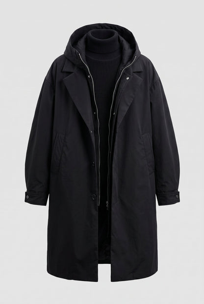 Black hooded raincoat displayed flat on a plain background, open to show the zip and storm flap 8