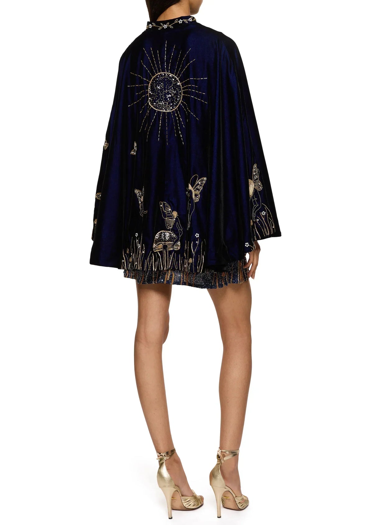 Back view of the dress under the navy velvet cape, which has a large gold sun and fairy embroidery 10