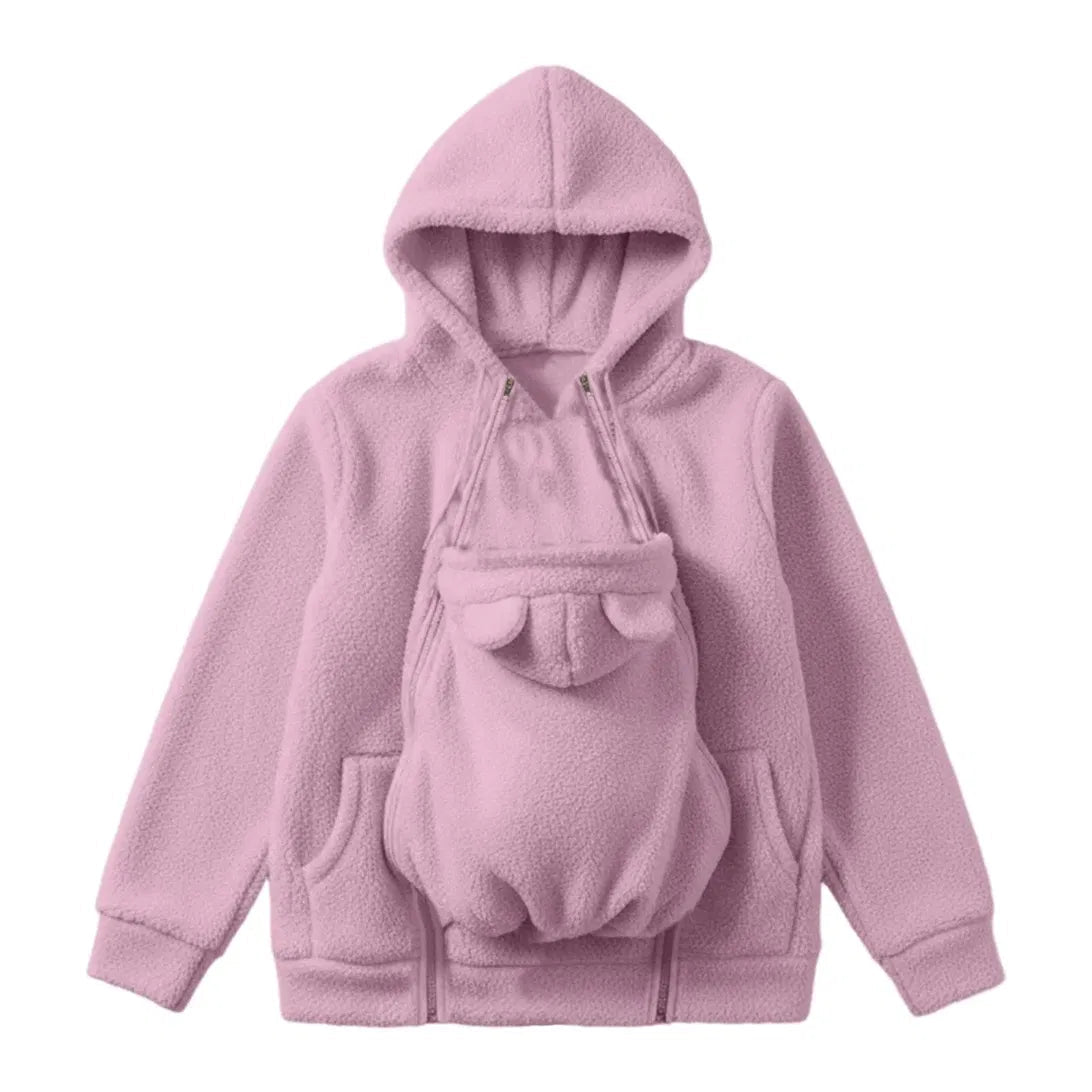 Flat lay of the pink sherpa fleece hoodie with the small ear-topped carrier panel zipped onto the front. 1