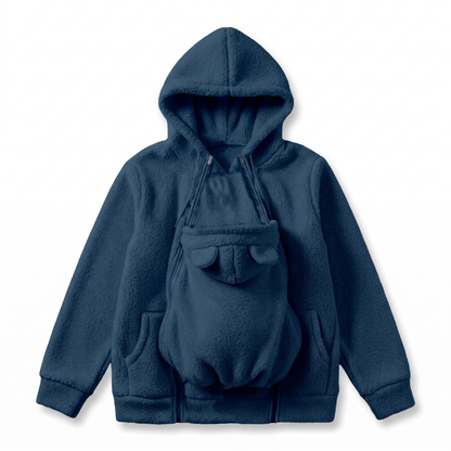 Flat lay of the navy blue sherpa fleece hoodie with the ear-topped baby carrier panel zipped onto the front. 10