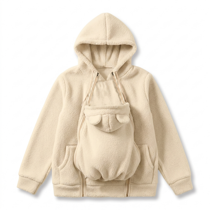 Flat lay of the cream sherpa fleece hoodie with the ear-topped baby carrier panel zipped onto the front. 11