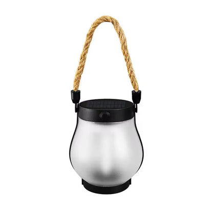 Unlit lantern on a white background showing the frosted glass, black solar top and rope handle 6