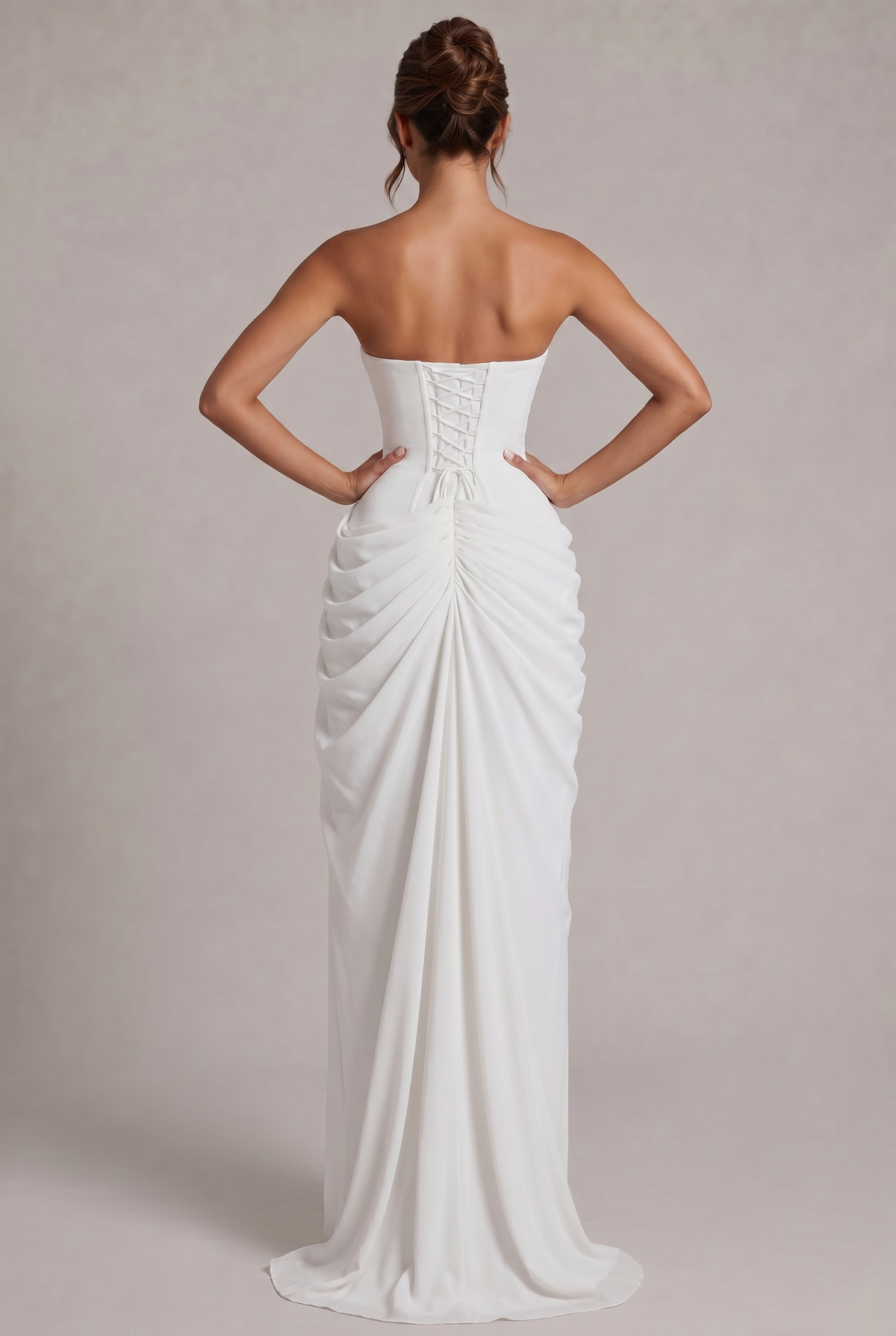 Back view of the white dress with lace-up corset back and ruched skirt with train 20