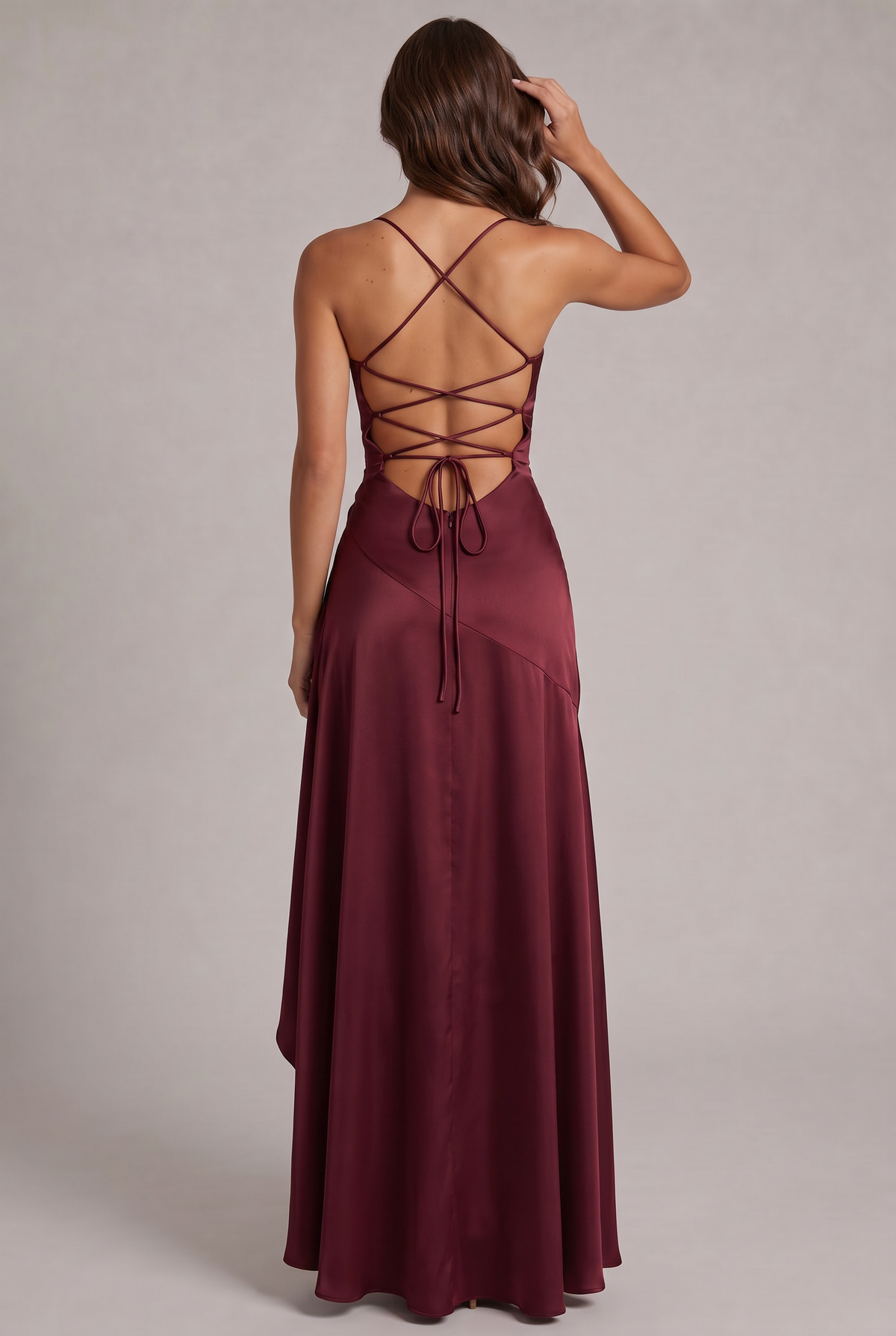 Back view of the burgundy dress showing the open back with criss-cross lace-up straps, tie and zip. 4