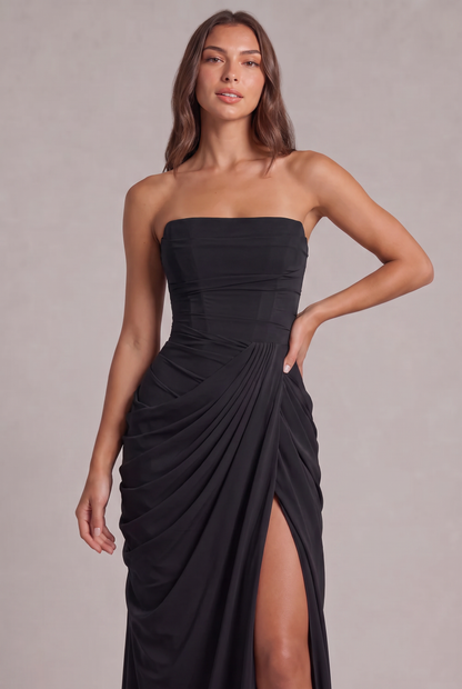 Close-up of the black corset bodice and pleated wrap draping at the waist 26