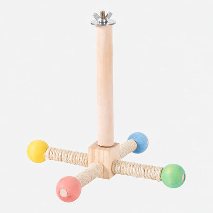 Wooden cage perch on a plain background, with a wing nut fixing at the top and four sisal-wrapped arms ending in coloured wooden balls. 1