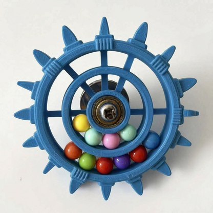 Blue version of the wheel toy with extra pointed spikes around the rim and a fuller set of coloured balls. 8