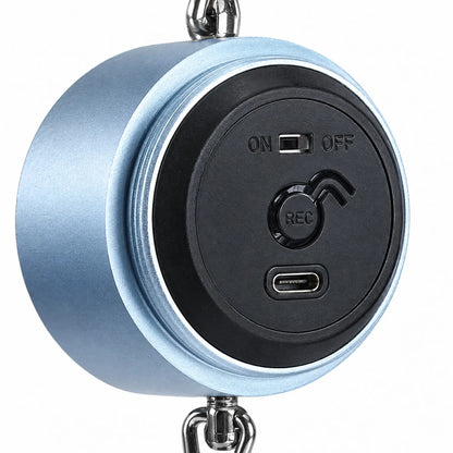 Close-up of the back panel of the blue round body, showing an on/off slider, a record button and a USB-C charging port. 3