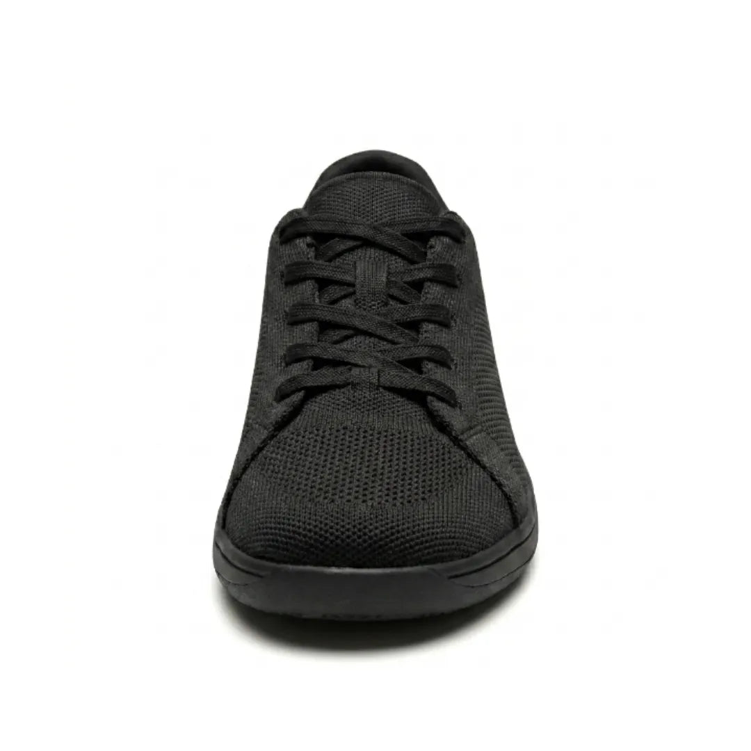 Front view of a black knit trainer showing the criss-cross laces, rounded wide toe cap and flat sole. 17