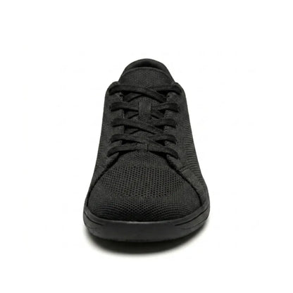 Front view of a black knit trainer showing the criss-cross laces, rounded wide toe cap and flat sole. 17