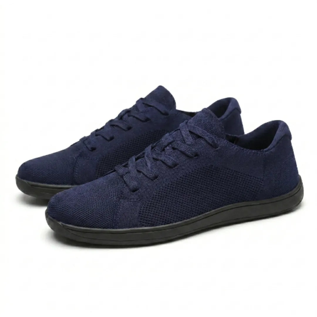 Pair of navy mesh lace-up trainers with black soles, shown from the front three-quarter angle. 25