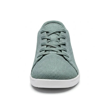 Front view of a sage green mesh trainer with white sole, showing the rounded wide toe and crossed laces. 35