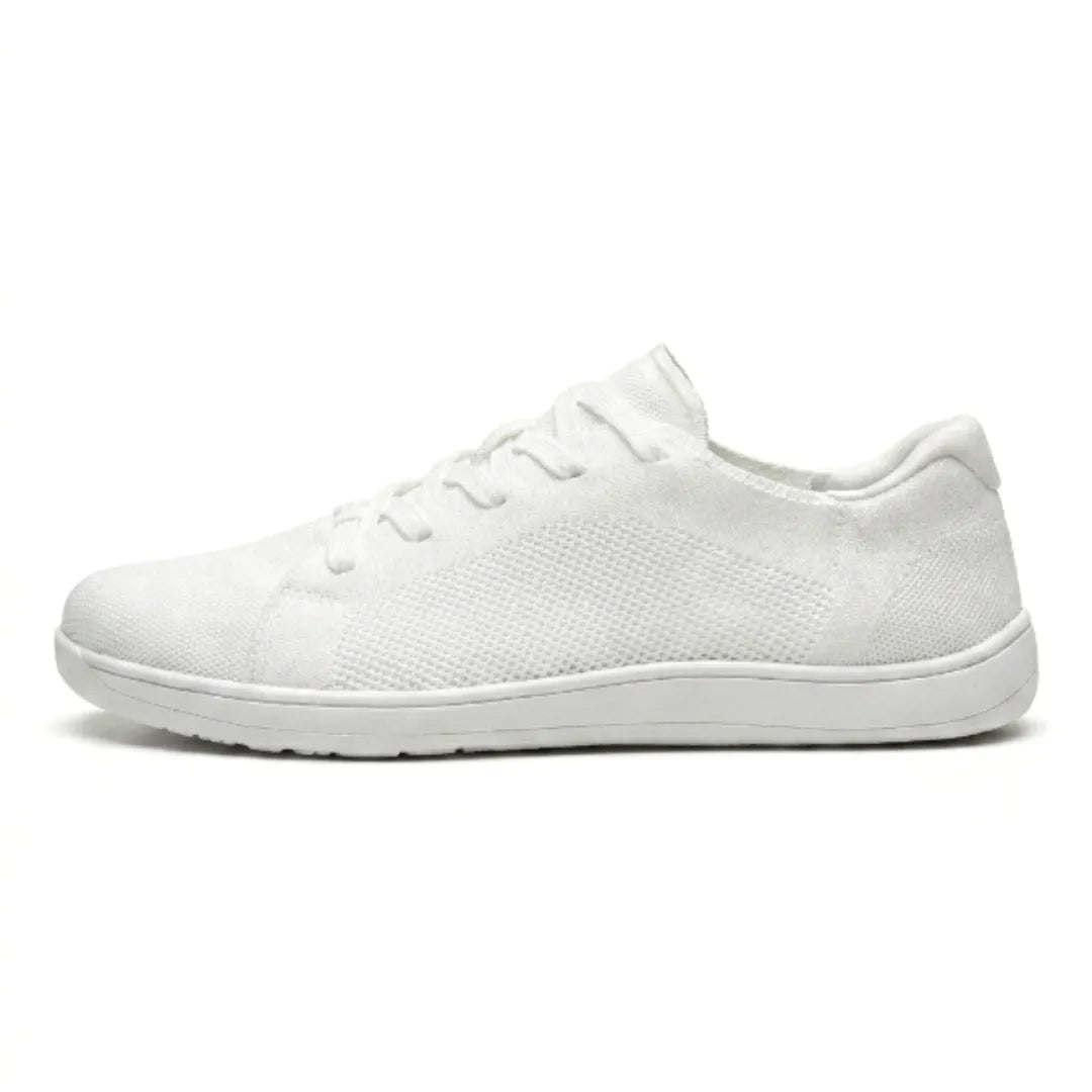 Side view of a single all-white mesh trainer with white sole and white laces. 37