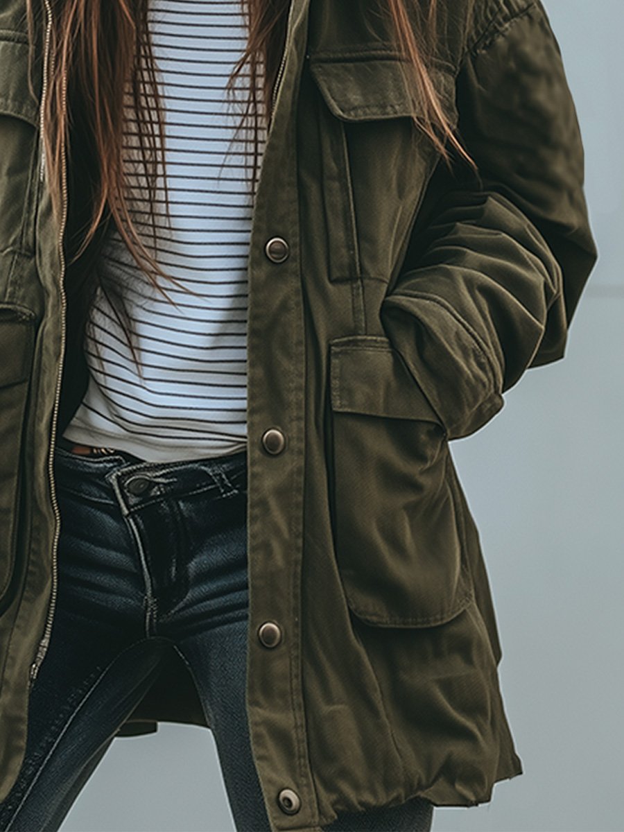 Close-up of the press-stud front placket and large flap pockets, with the jacket worn open over dark jeans. 3