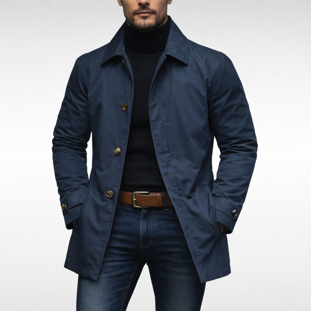 Studio front view of the jacket in navy, with gold-toned buttons, worn open over a black roll-neck and jeans. 2