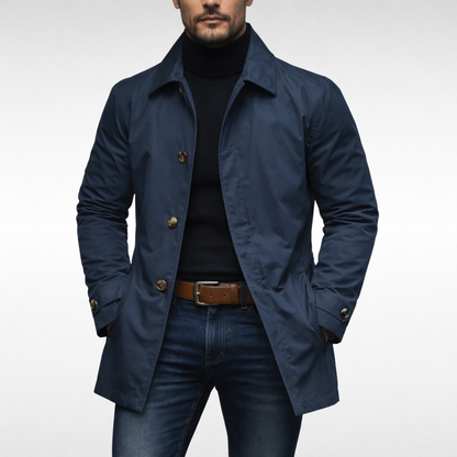 Studio front view of the jacket in navy, with gold-toned buttons, worn open over a black roll-neck and jeans. 2