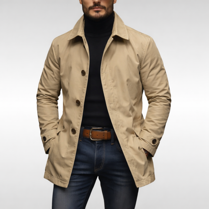 Studio front view of the jacket in beige, with brown buttons, worn open over a black roll-neck and jeans. 4
