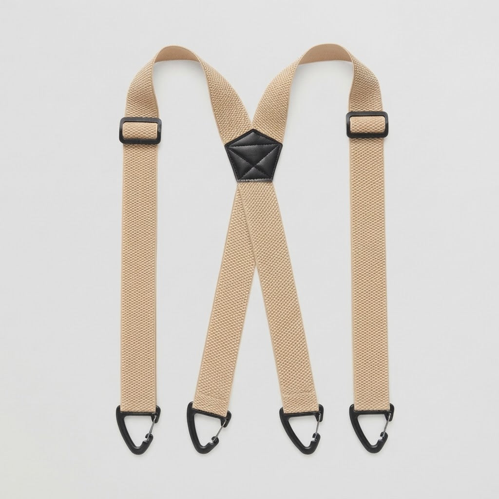Flat lay of beige X-shape braces with four black clip hooks and a black centre patch 15