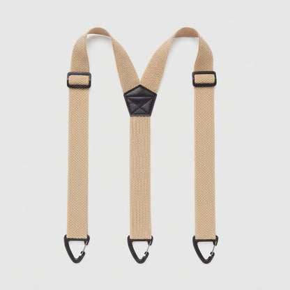 Flat lay of beige Y-shape braces with three black clip hooks and a black centre patch 14