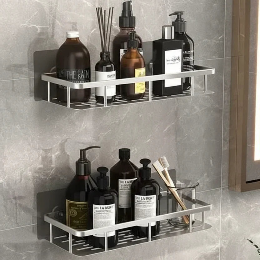 Two silver-toned shelves on white marble-effect wall, stocked with white skincare bottles and tubes 10